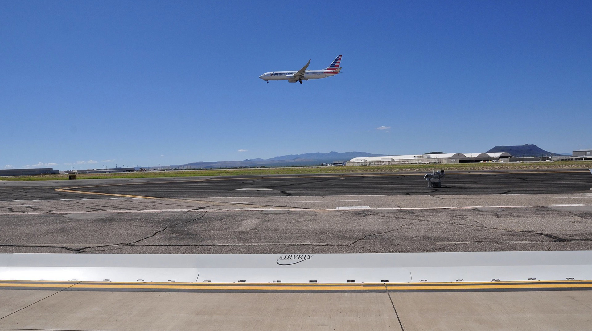 Collapsible FOD barrier system protecting commercial aircraft from foreign object debris