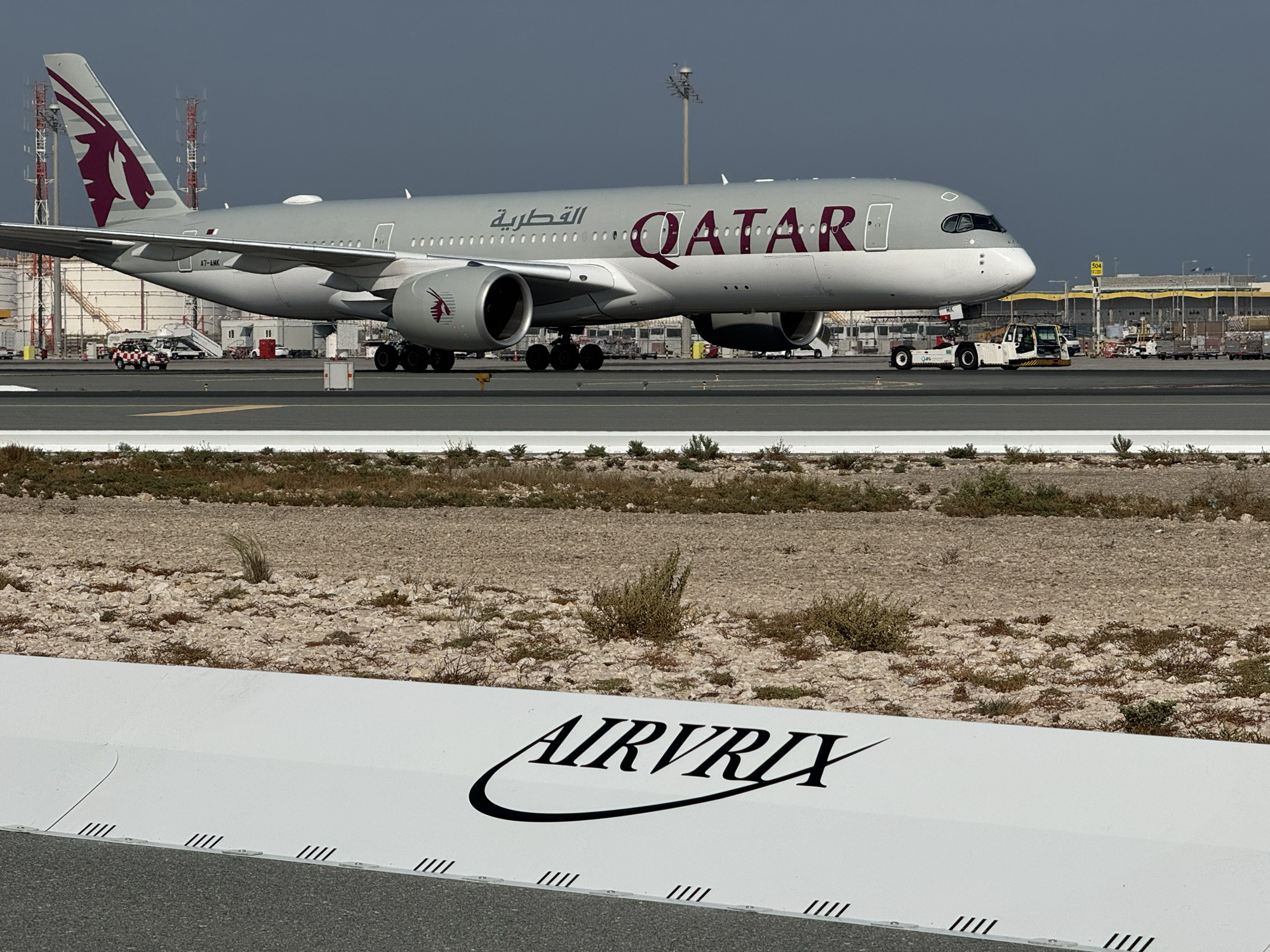 Commercial airport runway safety system with collapsible FOD barrier preventing aircraft engine damage