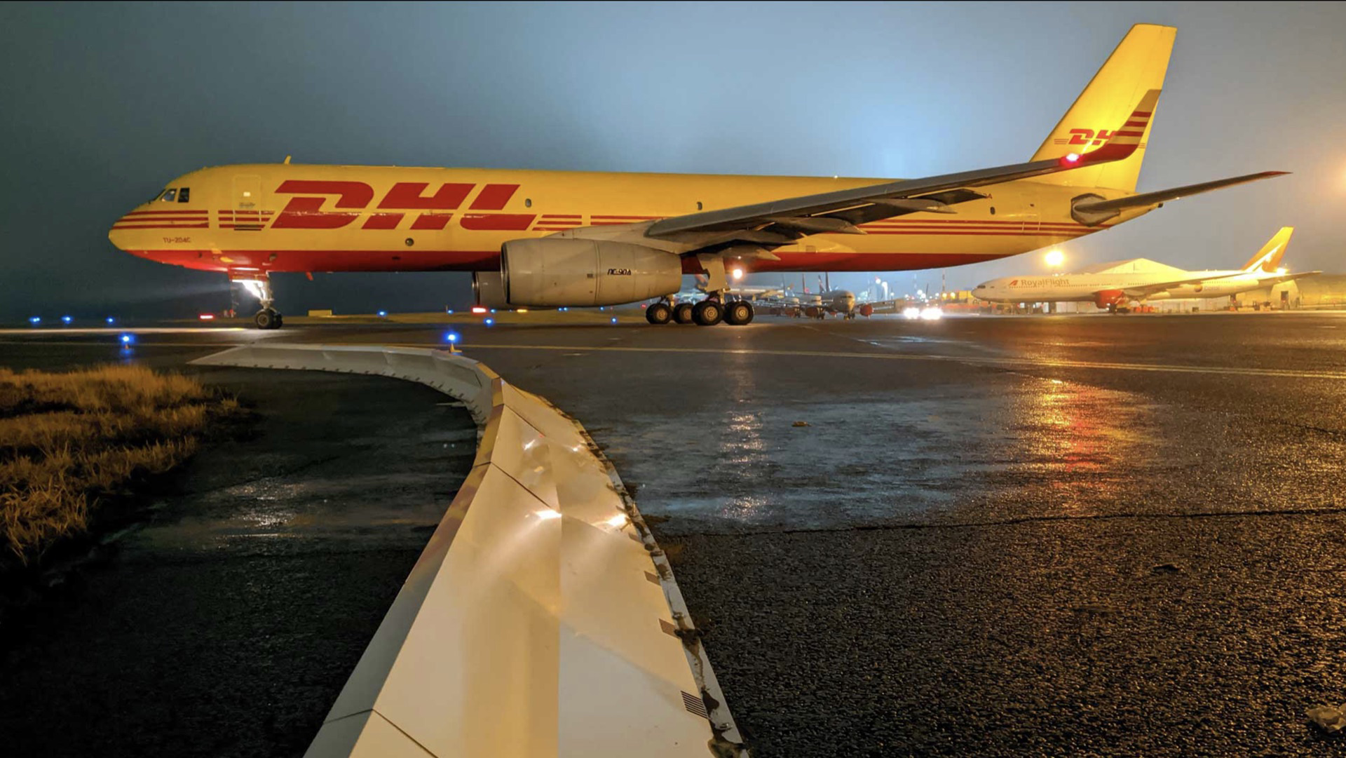 Commercial airport runway safety system with collapsible FOD barrier preventing aircraft engine damage